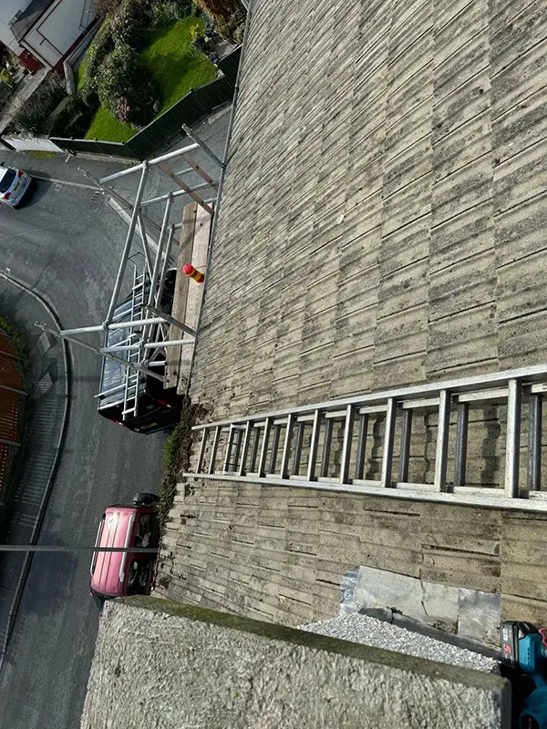Photograph of a roof being pressure washed clean by Rickard Cleaning Services, Tywyn